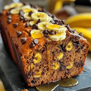 To make the best chocolate chip banana bread, you need the right ingredients. Here’s what you will need: - 3 ripe bananas, thoroughly mashed - 1/2 cup unsalted butter, melted and slightly cooled - 1/2 cup packed brown sugar - 1/4 cup granulated sugar - 2 large eggs, at room temperature - 1 teaspoon pure vanilla extract - 1 teaspoon baking soda - 1/4 teaspoon fine salt - 1 1/2 cups all-purpose flour - 1/2 cup semi-sweet chocolate chips These ingredients combine to create a rich, moist loaf. The ripe bananas add natural sweetness and flavor, while the chocolate chips melt into delicious pockets of chocolate. You can enhance your banana bread with a few optional ingredients. Consider adding: - 1/4 cup chopped walnuts - 1 teaspoon cinnamon - A splash of milk or yogurt for extra moisture Mixing in walnuts gives a nice crunch. A hint of cinnamon adds warmth and depth to the flavor. If you have dietary needs, there are simple swaps you can make. Here are some ideas: - Use coconut oil instead of butter for a dairy-free option. - Substitute flax eggs for regular eggs for a vegan version. - Choose gluten-free flour instead of all-purpose flour if you’re gluten-sensitive. These substitutions keep the bread tasty while catering to different diets. You can still enjoy a slice of chocolate chip banana bread without worry! Before you start, gather your tools. You’ll need: - A 9x5 inch loaf pan - A large mixing bowl - A spatula or wooden spoon - A whisk - A measuring cup and spoons Grease the loaf pan well. You can also line it with parchment paper. This makes it easy to take out the bread once it's done. Preheat your oven to 350°F (175°C) now. This way, it’s hot and ready when you finish mixing. Start by mashing three ripe bananas in your mixing bowl. Make sure they are very soft. Then, pour in half a cup of melted butter. Mix these two together until smooth. Next, add in half a cup of brown sugar and a quarter cup of granulated sugar. Stir well until the sugars dissolve completely. Now, crack in two large eggs, one at a time. Mix after each egg to blend it well. Add in one teaspoon of pure vanilla extract and mix again. This will add a nice flavor to your bread. Sprinkle one teaspoon of baking soda and a quarter teaspoon of fine salt over your mix. Gently fold these in. Be careful not to stir too hard, or your bread will get dense. Now, gradually add in one and a half cups of all-purpose flour. Fold it in gently until you see no dry flour. Finally, add half a cup of semi-sweet chocolate chips and fold them in. If you want, you can add a quarter cup of chopped walnuts for some crunch. Pour the batter into your greased loaf pan. Use a spatula to smooth the top. Place the pan in your preheated oven. Bake for 55-65 minutes. You know it’s done when a toothpick comes out clean or with a few moist crumbs. After baking, let the bread cool in the pan for about 10 minutes. Then, transfer it to a wire rack to cool completely. This helps it stay soft and fluffy. Enjoy your warm chocolate chip banana bread! You can find the full recipe in the earlier section. To make your banana bread moist and fluffy, follow these tips: - Use very ripe bananas. The darker, the better! - Make sure your butter is melted but not too hot. - Don’t over-mix the batter. Mix just until combined. - Let the bread cool slightly before slicing. This helps keep it from falling apart. These steps will help your bread rise nicely and stay soft. When baking banana bread, some mistakes can ruin your loaf. Here are a few to watch out for: - Using cold eggs can make the batter dense. Always use room-temperature eggs. - Not measuring your flour properly can lead to dry bread. Spoon the flour into your measuring cup, then level it off. - Adding too many chocolate chips can weigh down the bread. Stick to the recommended amount for the best balance. Avoiding these common mistakes will lead to a more delightful banana bread. Want to make your banana bread even better? Consider these add-ins: - Chopped nuts add a nice crunch. Try walnuts or pecans. - Spices like cinnamon or nutmeg give a warm flavor. Just a pinch can do wonders. - Swapping in dark chocolate chips can enhance the taste. They offer a richer flavor than semi-sweet. Adding these flavors can turn a good recipe into a great one. For the complete recipe, check out the Full Recipe. {{image_4}} You can switch up the chocolate chips for a new taste. Try using milk chocolate, dark chocolate, or even white chocolate. Each type gives the bread a unique flavor. You might even mix different chips together! This adds a fun twist to your banana bread. If you love peanut butter, try adding peanut butter chips. They pair well with the bananas. Fruits and nuts can enhance your banana bread. Chopped walnuts add a nice crunch. Pecans are another great choice. You can also add dried fruits, like raisins or cranberries. They bring sweetness and chewiness. Fresh fruits like berries can also work. Just be careful not to add too much, or your bread could get soggy. If you want a gluten-free version, use gluten-free flour instead of all-purpose flour. Many blends work well. Make sure to check the brand's details to ensure it fits your needs. You can also add a bit of xanthan gum to help the bread rise and stay together. This way, everyone can enjoy your tasty treat! For the full recipe, visit the link provided. To keep your chocolate chip banana bread fresh, store it in an airtight container. This helps prevent it from drying out. You can keep the bread at room temperature for up to three days. For longer storage, place it in the fridge. Keep in mind that cold storage can make it a bit dry. If you want to enjoy it longer, freezing is the best option. Freezing chocolate chip banana bread is simple. First, let it cool completely. Then, wrap it tightly in plastic wrap. For extra protection, place it in a freezer bag. Make sure to push out as much air as possible before sealing. You can freeze it for up to three months without losing quality. When you’re ready to eat, just take it out and let it thaw at room temperature. To reheat your chocolate chip banana bread, slice off the amount you want. Place slices on a microwave-safe plate. Heat them for about 10 to 15 seconds. If you prefer a crispy crust, try using an oven. Preheat it to 350°F (175°C) and warm the slices for about 5 to 10 minutes. This method brings back the fresh-baked taste and texture. Enjoy each bite like it’s just out of the oven! You can use mashed bananas or applesauce as an egg substitute. Use 1/4 cup of each for every egg. This keeps the bread moist and adds flavor. Other great options include flaxseed meal mixed with water or silken tofu. These choices help bind the ingredients well. Your bananas should be very ripe. Look for bananas with brown spots or a mostly brown skin. The ripe bananas add natural sweetness. They also make the bread softer and more flavorful. Overripe bananas are perfect for this recipe. Yes, you can skip the chocolate chips if you prefer. The bread still tastes great without them. You can add nuts, dried fruits, or spices like cinnamon instead. This allows you to customize the flavor to your liking. Banana bread lasts about 3-4 days at room temperature. Keep it in an airtight container to keep it fresh. You can also freeze it for up to 3 months. Simply wrap slices in plastic wrap and store them in a freezer bag. Enjoy your banana bread whenever you want! You now have all the tools to make perfect chocolate chip banana bread. From choosing the right ingredients to baking it just right, every step matters. Use my tips to get moist, fluffy bread. Remember, you can mix in flavors to make it unique. Enjoy storing and reheating your bread for fresh bites later. With these tips, you will impress everyone with your baking skills. Now, go ahead and bake that delicious bread!