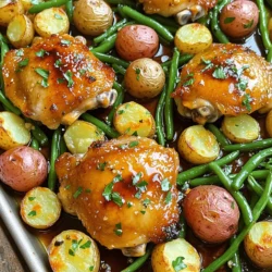 - 4 bone-in, skin-on chicken thighs - 1/4 cup pure maple syrup - 4 cloves garlic, finely minced - 2 tablespoons soy sauce (or tamari for a gluten-free option) - 1 tablespoon Dijon mustard - 1 tablespoon extra virgin olive oil - 1 teaspoon dried thyme - 1 teaspoon smoked paprika - Salt and freshly ground black pepper to taste - 1 pound baby potatoes, cut in half - 2 cups green beans, trimmed and ends removed - Fresh parsley, finely chopped (for garnish) Choosing good ingredients makes a big difference. Use pure maple syrup, not imitation. This syrup adds rich flavor and sweetness. Look for fresh garlic. It enhances the taste of the dish. For herbs, fresh thyme works best, but dried is fine too. When picking chicken, look for thighs with firm, pink skin. They should feel moist but not slimy. Always choose seasonal vegetables for the best taste. When you use fresh green beans, they add a nice crunch. If you need a gluten-free option, use tamari instead of soy sauce. You can swap chicken thighs for drumsticks or even breasts. Just adjust the cooking time. For a vegetarian option, try using firm tofu or hearty mushrooms. You can also replace baby potatoes with sweet potatoes or carrots. Each change adds its unique flavor, keeping the dish fun and fresh! Start by gathering all your ingredients. You need chicken thighs, maple syrup, garlic, soy sauce, Dijon mustard, olive oil, thyme, smoked paprika, and some fresh veggies. This recipe is simple and fun, making it great for a weeknight dinner. In a bowl, mix maple syrup, minced garlic, soy sauce, Dijon mustard, olive oil, thyme, smoked paprika, salt, and pepper. Whisk until smooth. Place chicken thighs in a large bowl or zip-top bag. Pour the marinade over them. Make sure each piece is well coated. For the best flavor, let it marinate for at least 15 minutes. If you have time, marinate overnight for even more flavor. 1. Preheat your oven to 400°F (200°C). 2. Spread halved baby potatoes on a baking sheet. Drizzle with olive oil, then sprinkle with salt and pepper. Toss to coat. 3. Roast potatoes for 15 minutes until slightly tender. 4. Take the baking sheet out and push the potatoes to one side. Place the marinated chicken thighs skin-side up in the empty space. 5. Return the pan to the oven. Roast for 25 minutes. The chicken should start browning. 6. Add trimmed green beans to the baking sheet. Drizzle with olive oil and season with salt and pepper. 7. Roast everything for another 15 minutes. The chicken needs to reach 165°F (75°C) inside. It should look golden brown. 8. Once done, take the pan out. Let it rest for a few minutes. This helps keep the juices in the chicken. To boost the flavor of your chicken, try adding more seasonings. A pinch of chili powder can bring some heat. You can also add fresh herbs like rosemary or oregano for a fragrant touch. If you enjoy a bit of sweetness, a splash of balsamic vinegar works well. Experiment with these in the marinade to find your perfect taste. To check if your chicken is done, use a meat thermometer. Insert it into the thickest part of the thigh. The chicken should reach an internal temperature of 165°F (75°C). This ensures it is safe to eat and juicy. If you don’t have a thermometer, make a small cut in the thigh. The juices should run clear, not pink. Garnishing can elevate your dish. After roasting, sprinkle freshly chopped parsley over the chicken and veggies. This adds color and freshness. For a bright touch, serve with lemon wedges on the side. You could also arrange everything on a large platter for a family-style meal. This makes it inviting and fun to share. {{image_4}} You can swap out vegetables in this dish easily. Instead of green beans, try broccoli or asparagus. Carrots work well too. If you want extra color, add bell peppers or zucchini. Just cut them to a similar size for even cooking. You can even mix in some cherry tomatoes for a sweet burst of flavor. Use any fresh or frozen veggies you love! This recipe isn’t just for the oven. You can grill the chicken thighs for a smoky taste. Just marinate as usual, then cook on medium heat for about 6-7 minutes per side. For stovetop cooking, heat a pan over medium-high. Sear the thighs skin-side down first for crispiness. Cook for about 7-8 minutes on each side until they reach 165°F (75°C). This keeps the meat juicy and tender. Feel free to get creative with the marinade! Try adding orange juice instead of maple syrup for a citrus twist. You can also mix in some ginger for a bit of spice. If you want a tangy kick, add balsamic vinegar or apple cider vinegar. For a spicy twist, include a dash of hot sauce or chili flakes. These changes will give you new flavors while keeping the dish exciting. To store leftovers, let the chicken cool first. Place it in an airtight container. Use glass or plastic containers that seal well. Store in the fridge for up to four days. Make sure to keep the chicken and veggies together for the best flavor. For reheating, the oven works best. Preheat it to 350°F (175°C). Place the chicken and veggies on a baking sheet. Cover them with foil to keep them moist. Heat for about 15 to 20 minutes. You can also use a microwave if you're short on time. Just make sure to cover the dish and heat in short bursts. To freeze this dish, let it cool completely. Wrap each piece in plastic wrap, then place it in a freezer bag. Squeeze out as much air as you can. This helps prevent freezer burn. You can freeze it for up to three months. When ready to eat, thaw it in the fridge overnight before reheating. Yes, you can use boneless chicken thighs. They will cook faster than bone-in thighs. Adjust your cooking time. Start checking for doneness at around 20 minutes. Boneless thighs will still soak up the maple garlic flavor. To keep the chicken tender, marinate it for at least 15 minutes. For the best results, let it sit overnight. The marinade's acidity from the mustard and soy sauce helps break down the meat. Always check that your chicken reaches 165°F for safe eating. This dish pairs well with many sides. Consider serving with: - Garlic bread for a warm touch - A fresh salad for crunch and color - Rice or quinoa for a hearty option - Grilled corn for a sweet contrast Each side enhances the meal’s flavor and makes it more filling. Enjoy experimenting with your favorites! In this article, we explored the key ingredients and preparation methods for a delicious chicken dish. We discussed quality choices, marinating techniques, and cooking tips. You learned how to enhance flavors and ensure proper doneness. Variations and storage methods were also covered. Overall, these steps help you create a tasty meal that suits your needs. With these tips, you can confidently cook and enjoy your dish. Happy cooking!