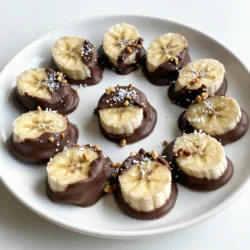 - 2 ripe bananas - 1 cup dark chocolate chips - 1 tablespoon coconut oil To make chocolate covered banana bites, you need just three main ingredients. First, choose two ripe bananas. They should have a few brown spots for sweetness. Next, grab one cup of dark chocolate chips. Dark chocolate gives a rich flavor. Finally, use one tablespoon of coconut oil. This oil helps the chocolate melt smoothly. - Crushed nuts (almonds or walnuts) - Shredded coconut - Colorful sprinkles You can add fun toppings to your banana bites. Crushed nuts like almonds or walnuts add crunch. Shredded coconut gives a tropical twist. Colorful sprinkles can make them look festive. These toppings are not just tasty; they also make your treats more exciting! {{ingredient_image_2}} Start by peeling the bananas. Use ripe bananas for the best flavor. Next, slice them into thick rounds, about 1 inch wide. This size helps keep them sturdy when you dip them. Lay the banana slices on a baking sheet lined with parchment paper. Make sure they do not touch each other. This will keep them from sticking together. Now, put the baking sheet in the freezer. Let the banana slices freeze for about 30 minutes. They should feel firm when you touch them. While the bananas freeze, it&rsquo;s time to melt the chocolate. You can use a double boiler. To do this, fill a pot with water and bring it to a gentle simmer. Place a heatproof bowl on top, making sure it doesn&rsquo;t touch the water. Add the dark chocolate chips and coconut oil to the bowl. Stir until the mixture is smooth and glossy. If you prefer, you can melt the chocolate in the microwave. Heat it in short 30-second bursts. Keep stirring until it is fully melted. Once the banana slices are frozen, take them out of the freezer. Dip each slice into the melted chocolate. Make sure the chocolate covers each piece fully. This makes for a rich flavor. Place the chocolate-covered slices back on the parchment-lined baking sheet. Leave some space between them. While the chocolate is still wet, sprinkle a pinch of sea salt on each slice. You can also add toppings like crushed nuts, shredded coconut, or colorful sprinkles. These add fun flavors and textures. Return the baking sheet to the freezer for another 15-20 minutes. This will help the chocolate set firm around each slice. To get your chocolate coating just right, start with melting the chocolate. Use a double boiler or microwave. If using a microwave, heat the chocolate chips in 30-second bursts. Stir after each burst. This keeps the chocolate smooth and avoids burning. Next, add a tablespoon of coconut oil to the chocolate. This makes the chocolate shiny and helps it coat better. The coconut oil also adds a nice flavor. When you dip the frozen banana slices, make sure they are fully covered. This ensures each bite has a good chocolate taste. After dipping, place them back on the lined baking sheet. Now for freezing! Freeze the banana bites for at least 15-20 minutes after coating. This helps the chocolate set firm. If they are not fully frozen, they may get messy when you serve them. Serving chocolate-covered banana bites can be fun! You can place them in a colorful bowl or on a bright plate. This makes them look more inviting. For added flair, sprinkle some extra toppings on top. You could use crushed nuts, shredded coconut, or colorful sprinkles. They not only taste great but also look pretty! If you want to impress your guests, dust a little cocoa powder over them. This adds a professional touch. Enjoy these treats as a fun snack or a dessert! Pro Tips Choose the Right Bananas: Select ripe bananas that are firm but not overly soft; they will hold their shape better during freezing and coating. Use Quality Chocolate: Opt for high-quality dark chocolate for a richer flavor; chocolate with a high cocoa content will provide a more decadent taste. Experiment with Toppings: Get creative with toppings! Try adding different nuts, seeds, or even a drizzle of caramel for an extra layer of flavor. Storage Tips: Store any leftover bites in an airtight container in the freezer to maintain freshness and prevent freezer burn. {{image_4}} You can use different types of chocolate for your banana bites. Milk chocolate gives a sweet taste. It melts easily and coats the bananas well. Dark chocolate is richer and has a deep flavor. It pairs nicely with the bananas&rsquo; sweetness. If you want something unique, try white chocolate. It adds a creamy, sweet touch. Each chocolate type creates a different taste and look, so feel free to mix and match. To make your banana bites even more exciting, try adding spices or extracts. A pinch of cinnamon gives a warm flavor. Vanilla extract adds a nice touch, too. You can even add a dash of chili powder for a spicy kick! Don't forget about toppings! You can sprinkle crushed nuts on top for crunch. Shredded coconut adds a tropical feel. Colorful sprinkles can make them fun for kids. Experiment with different flavors to find your favorite combination! To store leftover chocolate-covered banana bites, place them in an airtight container. Layer pieces with parchment paper to avoid sticking. This keeps them fresh and easy to grab. For freezer storage, use a freezer-safe bag or container. Remove as much air as possible. This helps prevent freezer burn and keeps the bites tasty. To maintain texture in the freezer, ensure the bites are fully frozen before storing. This prevents them from becoming mushy when thawed. When frozen, chocolate-covered banana bites can last up to two months. Just remember to check the container for tight sealing. Signs of quality deterioration include ice crystals on the chocolate. If the chocolate looks gray or dry, it may not taste as good. Also, check the banana bites for any unusual smells. You can use frozen bananas, but they will change the texture. Fresh bananas give a nice bite. Frozen bananas may become mushy once thawed. If you want to use them, make sure to slice and freeze them first. This helps them keep their shape when coated with chocolate. You can use butter or ghee instead of coconut oil. Both will work well for melting chocolate. If you're looking for a dairy-free option, try using vegetable oil or shortening. Just keep in mind that these oils may change the flavor a bit. The chocolate should be smooth and shiny. If it looks thick or clumpy, it is not melted well. Stir it gently while melting. If you use the microwave, heat it in short bursts of 30 seconds. This method helps avoid burning the chocolate. Once it&rsquo;s smooth, it&rsquo;s ready for dipping! This blog post covered how to make delicious chocolate-covered bananas. You'll need ripe bananas, dark chocolate chips, and coconut oil. I shared step-by-step instructions, tips for perfect coating, and ideas for tasty toppings. You can customize these treats with different chocolates and flavors. Remember to store them right to keep that great taste. I hope you&rsquo;re excited to try this easy and fun recipe!