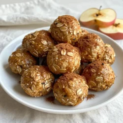 - 1 cup rolled oats - 1/2 cup almond butter (or peanut butter alternative) - 1/2 cup finely chopped dried apples - 1/4 cup honey or maple syrup - 1 teaspoon ground cinnamon - 1/2 teaspoon pure vanilla extract - 1/4 cup ground flaxseed (optional) - 1/4 cup mini chocolate chips or chopped nuts (optional) To make Apple Cinnamon Energy Bites, start by gathering all your ingredients. Each one plays a key role in flavor and nutrition. Rolled oats are the base of the bites. They offer fiber and help fill you up. Almond butter adds healthy fats and protein. You can swap it for peanut butter if you prefer. Dried apples give a sweet and fruity flavor. They also add natural sugars that boost energy. Honey or maple syrup acts as a natural sweetener and binds the ingredients. Ground cinnamon brings warmth and spice. It enhances the apple flavor and adds health benefits. Vanilla extract adds a sweet aroma, making the bites even more tasty. Ground flaxseed is optional but adds extra fiber and omega-3s for health. Lastly, mini chocolate chips or chopped nuts can add a fun crunch. They also give a sweet touch if you like a richer flavor. By using these ingredients, you create a snack that is not only fun to make but also packs a powerful punch of energy and nutrients. {{ingredient_image_2}} To start, gather your ingredients. In a large bowl, mix the rolled oats, almond butter, chopped dried apples, honey or maple syrup, ground cinnamon, vanilla extract, and ground flaxseed if you want. Stir well until all the ingredients blend smoothly. If the mix is too dry, add a splash of water or more almond butter. You want a sticky texture that can hold together. Next, take about one tablespoon of the mixture and roll it into a ball. Keep going until you shape all the mixture into bites. If you like, you can add mini chocolate chips or chopped nuts for more fun flavors and textures. Refrigeration is key. Place the rolled bites on a parchment-lined baking sheet. Make sure they are not too close together. Chill them in the fridge for at least 30 minutes. This helps them firm up, making them easier to handle. Once they are set, you can store them in an airtight container. They last up to a week in the fridge or can be frozen for later. To make these bites just right, you might want to adjust the sweetness. If you want a sweeter taste, add more honey or maple syrup. If you find them too sticky, add a little more oats to balance it out. Remember, almond butter can be swapped with peanut butter if you prefer a different flavor or if you have nut allergies. When it comes to serving, get creative! You can place the energy bites in a cute mason jar for a fun touch. Try sprinkling a bit of cinnamon on top or add fresh apple slices for color. These bites pair well with tea, coffee, or even yogurt. Enjoy them as a quick snack or a pre-workout boost. For storage, keep your energy bites in an airtight container in the fridge. They will stay fresh for about a week. Want to save some for later? You can freeze them! Just place them in a freezer-safe bag. When you want one, let it thaw in the fridge for a few hours. This way, you have a tasty snack ready whenever you need it! Pro Tips Use Fresh Ingredients: Always opt for fresh, high-quality dried apples to enhance the flavor and texture of your energy bites. Customization is Key: Feel free to experiment with different nut butters or add-ins like seeds, coconut flakes, or protein powder for a personalized touch. Sticky Hands Solution: If the mixture is sticky while rolling, dampen your hands slightly with water to make shaping the bites easier. Perfect Storage: Store the energy bites in small, portion-sized containers for on-the-go snacks that stay fresh and delicious. {{image_4}} You can easily mix up the flavor of your apple cinnamon energy bites. Here are some fun ideas: - Add spices: Try nutmeg or ginger for a warm touch. These spices blend well with cinnamon. - Use other dried fruits: Dried cranberries or apricots can give a sweet twist. Their chewy texture adds more joy to each bite. Want to make your energy bites even better? Here are some great options: - Add protein powder: This gives your bites a protein boost. It helps keep you full longer. - Try superfoods: Ingredients like chia seeds or spirulina can add nutrients. They raise the health value of your snack. - Choose vegan sweeteners: Maple syrup works great if you want a vegan option. It replaces honey well and tastes sweet. Texture can change your energy bites from good to great. Here&rsquo;s how to make them more fun: - Incorporate seeds or grains: Add chia seeds or quinoa for crunch. These ingredients give a unique bite. - Switch nut butters: If you prefer, use peanut butter instead of almond butter. It changes the taste and can be creamier. These variations keep your energy bites exciting and nutritious. Try them out and find your favorite mix! Apple Cinnamon Energy Bites are packed with quick energy. They use rolled oats, almond butter, and honey. These natural ingredients give your body a swift lift. Oats provide complex carbs for steady energy. Almond butter offers healthy fats and protein to keep you full. Honey gives you natural sugar for that instant boost. This snack fuels your day, whether at work or play. These energy bites are not just tasty; they are healthy too. Oats are rich in fiber. They help with digestion and keep you full longer. Apples add vitamins and antioxidants, boosting your immune system. Almond butter has healthy fats, which are great for your heart. Flaxseed, if you add it, offers omega-3s, promoting brain health. Each bite is a mix of nutrition and flavor, making it a smart choice. These energy bites fit all kinds of lifestyles. Athletes can use them for pre-game fuel. Busy professionals can grab one for a quick snack. Families can enjoy them together at home. They are easy to make and store well. Just keep them in the fridge or freeze them. Whether you are on the go or relaxing, these bites are perfect for everyone. Yes, you can make these energy bites vegan! To do this, simply swap out the honey for maple syrup. This change keeps the sweetness without using animal products. You can also use peanut butter instead of almond butter if you prefer. Both options work well. These energy bites last about one week in the fridge. To keep them fresh, store them in an airtight container. If you want them to last longer, freezing is a great option. Absolutely! To freeze these bites, first shape them into balls and then place them on a baking sheet. Put the sheet in the freezer for about 30 minutes. Once they are firm, transfer them to a freezer bag or container. They can last up to three months in the freezer. To eat, just take out a few and let them thaw at room temperature for about 15 minutes. Enjoy! These apple cinnamon energy bites are simple, tasty, and healthy. You learned how to mix and shape the ingredients, plus tips for storage and serving. Remember, you can customize flavors and nutrition to fit your needs. Whether you are busy or active, these bites offer a great energy boost. Enjoy making them your way, and always explore new variations. Fuel your days with this easy snack that fits any lifestyle.